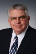 Commissioner David L. Levacy man posing wearing a suit and tie