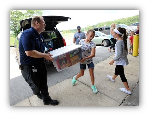 man collecting donations from kids