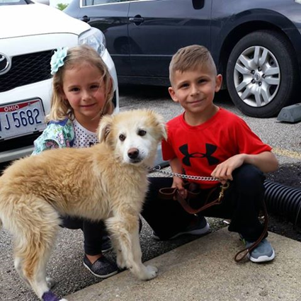 happy-trails-2 kids sitting with dog